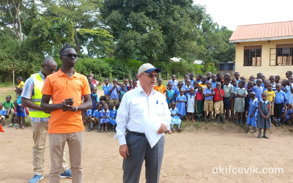 students and project volunteers gathered in a school yard