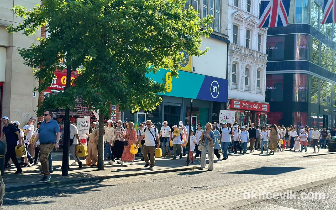 participants making their way along the street on the walk4water march