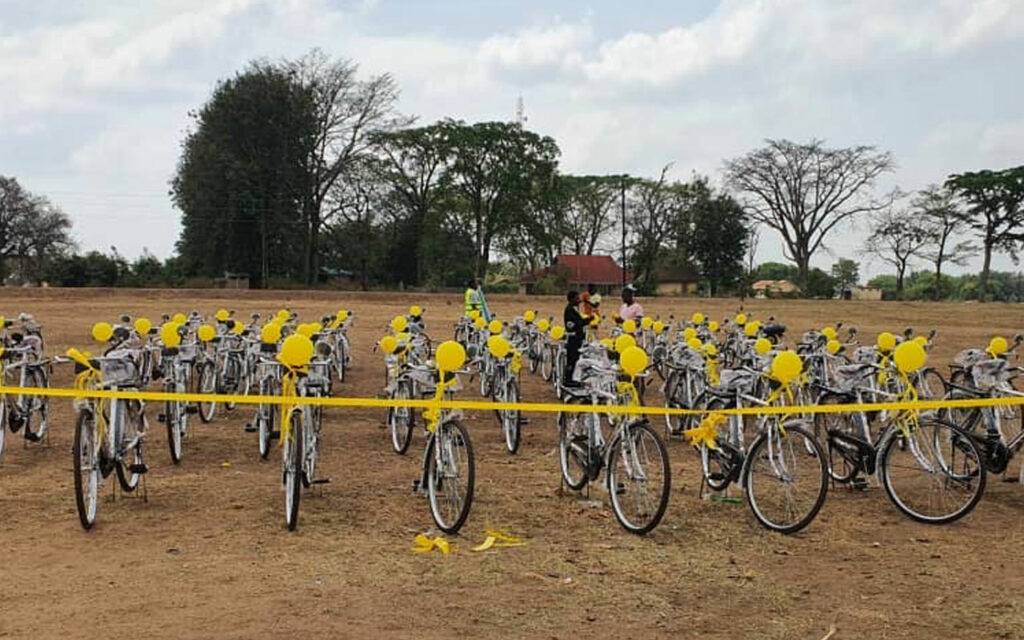 yellow bicycles lined up for distribution